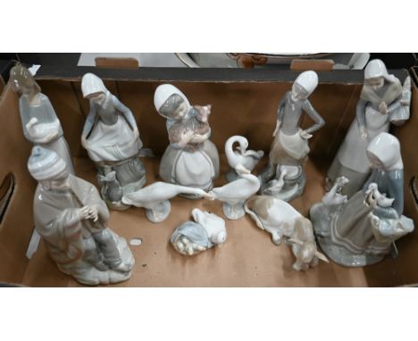 Three Lladro figures of country girls, a cow and four bird ornaments, to/w four Nao figures (12) (box) 