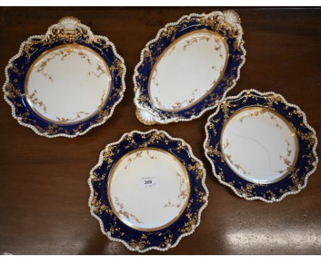 Two Royal Worcester blue and gilt serving dishes with shell handles, to/w two matching 22.5cm plates; date marks for 1912 