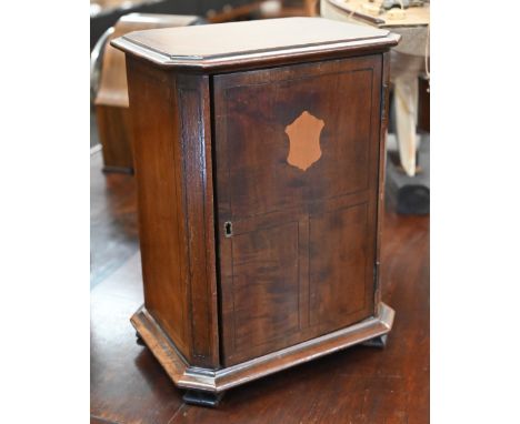 A 19th century mahogany table cabinet fitted with three sliding galleried shelves, on bracket feet, 27 x 21 cm (possibly an '