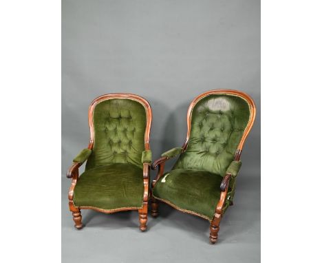 Two Victorian button backed salon armchairs, in green dralon with serpentine seats, raised on turned front legs (2) 