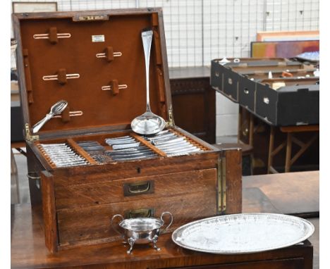 An oak cutlery canteen, containing a set of six each Hanoverian table knives and tea knives with EP handles, a set of six EP 