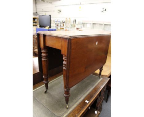 A 19th century mahogany rectangular drop leaf gate leg dining table.