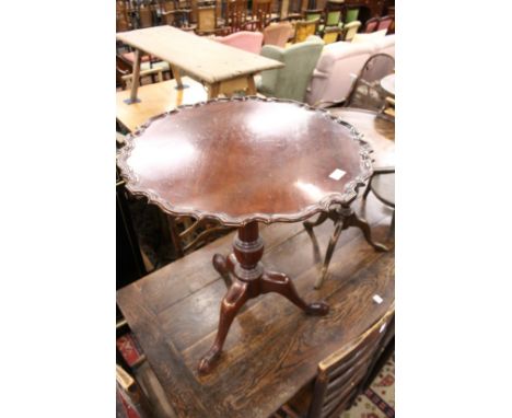 A George III design mahogany pie crust tripod table.