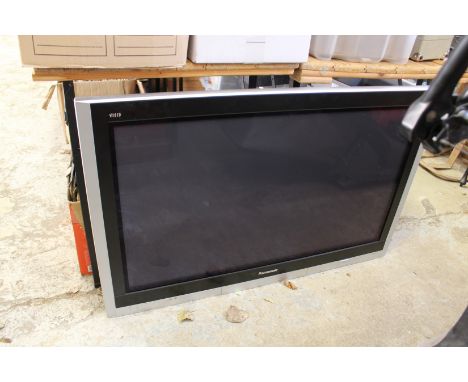 A large Panasonic flat screen TV with wall mounting bracket.