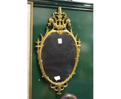 A gilt framed mirror.