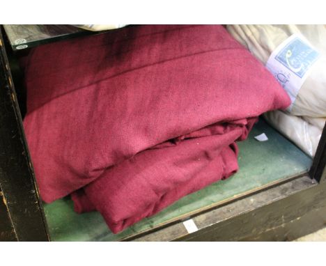 Dark red Hessian style curtains.