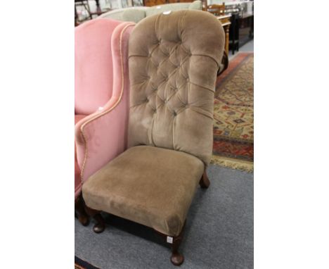 A button upholstered bedroom chair.