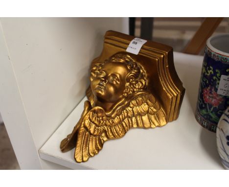 A cherub wall bracket.