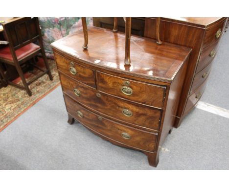 A small 19th century mahogany bow front chest of two short and two long drawers on splay bracket feet.