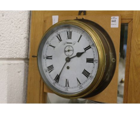 A ship's style brass cased clock.