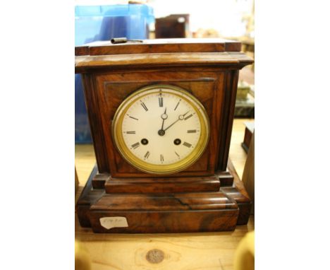 A good Victorian cased walnut mantle clock.