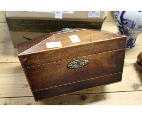A 19th century mahogany sarcophagus shaped tea caddy.