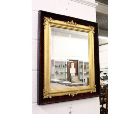 A decorative gilt framed mirror contained in a velvet lined case.