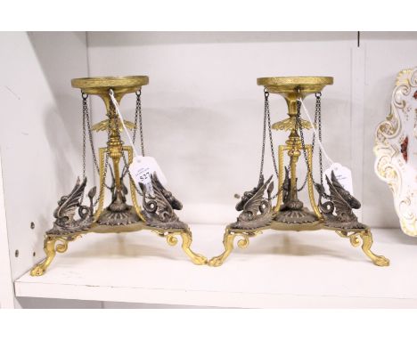 A good pair of decorative ormolu and silver plated stand modelled in the classical style.