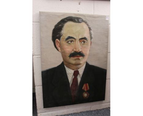 Russian School, a bust length portrait of a gentleman wearing a medal Order of Lenin, oil on canvas, unframed.