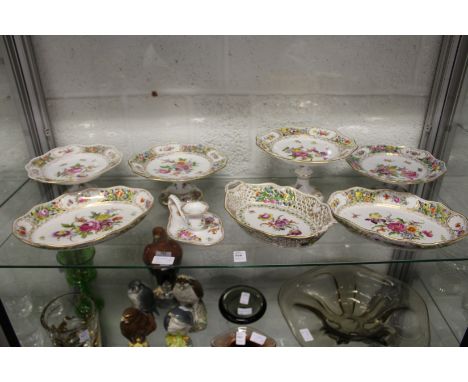 A good collection of Dresden floral decorated porcelain to include comports, dishes and a chamber stick.