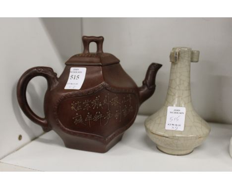 A Chinese Yixing teapot and a small bottle vase (AF).