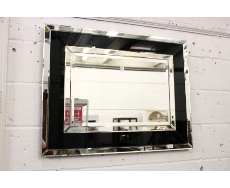 An Art Deco style rectangular wall mirror.