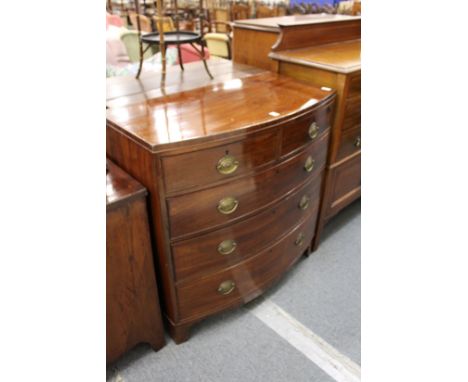 A 19th century mahogany bow front chest of two short and three long graduated drawers on bracket feet.