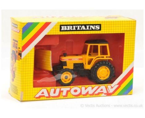 Britains 9812 Ford 7710 tractor- yellow, black - Near Mint (requires very light attention cleaning) in a Good Plus "Autoway" 