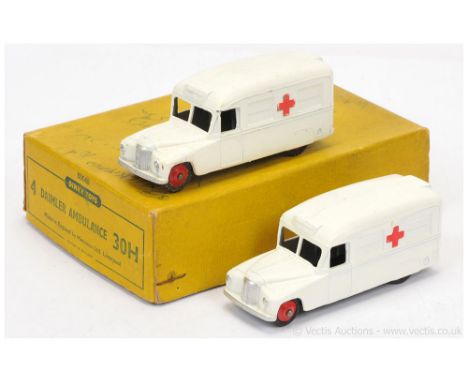 Dinky 30h Trade Pack Daimler "Ambulance" containing 2 examples - both finished in bright white, silver trim, red ridged hubs 