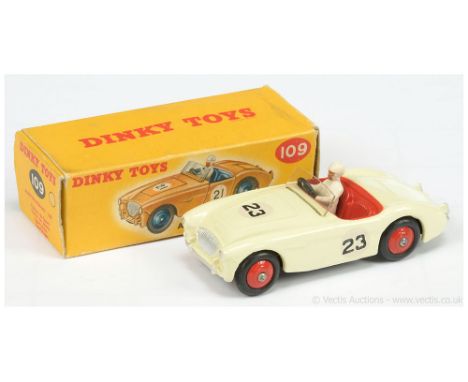 Dinky 109 Austin Healey 100 Sports Car - pale cream body, bright red interior and ridged hubs with smooth tyres, figure drive