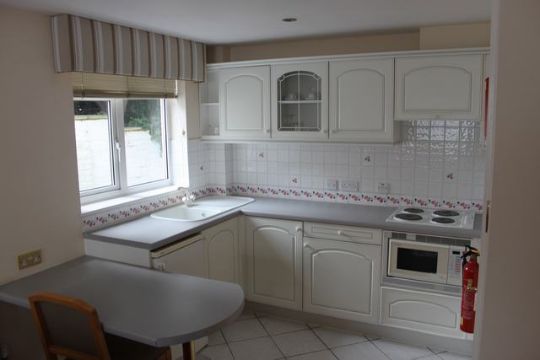 Kitchen range comprising of base unit and wall cupboards ...