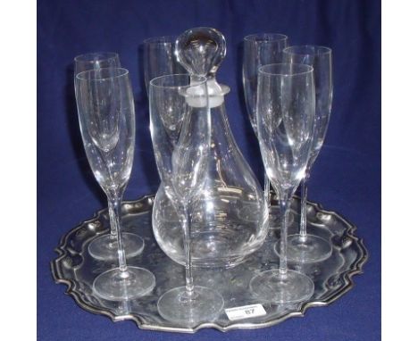 Glass decanter and seven glass champagne flutes on silver plated salver style tray with bright cut engraving