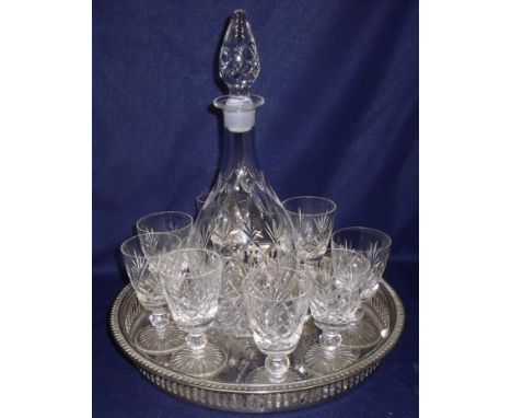 Cut glass decanter and set of eight cut glass sherry glasses on silver plated gallery tray