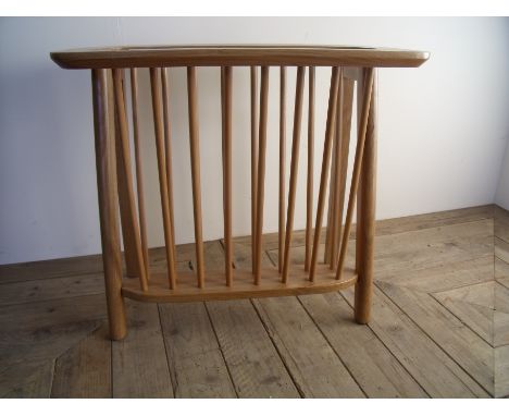 Light elm Ercol style occasional table / magazine rack (width 56cm)