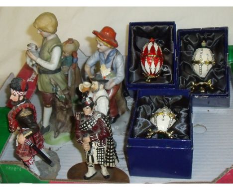 Three boxed decorative egg ornaments and small selection of ceramic figurines