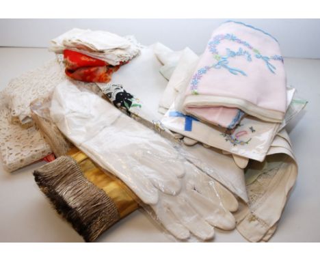 A BASKET OF MIXED VINTAGE LINEN AND COTTONS TO INCLUDE LADY'S GLOVES, BABY'S VESTS, DRESSING TABLE MATS AND A HAND EMBROIDERE
