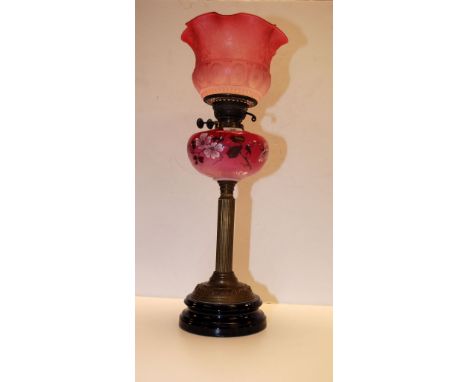 A CRANBERRY OIL LAMP WITH BRASS CORINTHIAN COLUMN, PAINTED CRANBERRY FONT AND ETCHED CRANBERRY GLASS FRILLED SHADE (NO CHIMNE