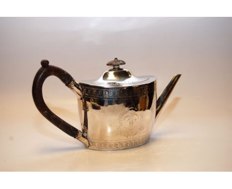 A GEORGE III SILVER TEAPOT OF OVOID FORM, THE DECORATION INCLUDING THE MONOGRAM W. LONDON 1797, INCLUDING WOODEN HANDLE 450G 