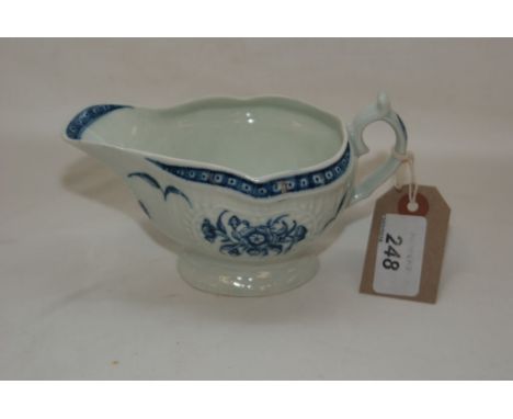 A WORCESTER SAUCE BOAT, THE RESERVES PAINTED WITH FLOWERS, LENGTH 15.5 CM 