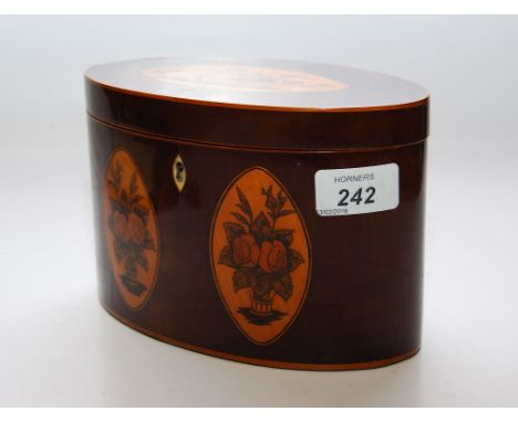 A GEORGE III MAHOGANY OVAL TEA CADDY INLAID WITH FLORAL PANELS 