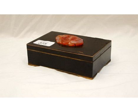 BRASS BLACK ENAMELLED CIGARETTE BOX MOUNTED WITH ORANGE JADE OAK LEAF (ENAMEL A/F) 