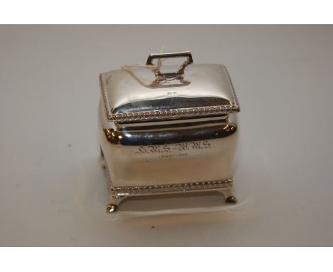 A SMALL PRESENTATION SILVER TEA CADDY , GADROONED DETAIL SUPPORTED ON OGEE FEET 