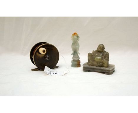 A SMALL CARVED JADE BUDDHA, A SMALL JADE CARVED DEITY AND A EARLY BRASS FISHING REEL ENGRAVED C. FAIRLOW LTD, LONDON CIRCA 19