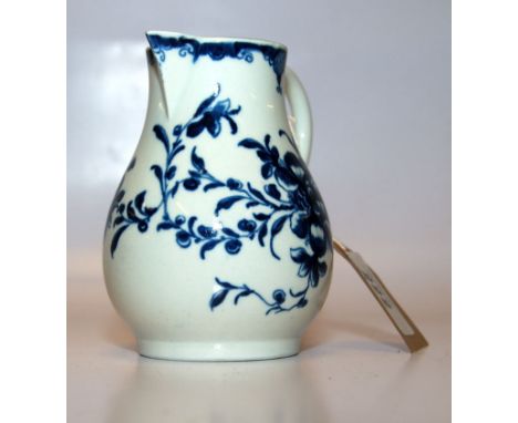 A WORCESTER BLUE AND WHITE CREAM JUG WITH LOOP HANDLE PAINTED WITH FLOWERS, HEIGHT 11 CM 
