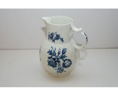 WORCESTER BLUE AND WHITE CABBAGE LEAF MASKED JUG PRINTED WITH ROSES AND OTHER FLOWERS (CHIP TO SPOUT) 20.5 CM 