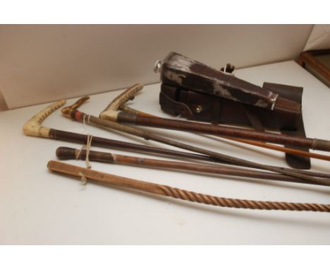 A SELECTION OF SIX RIDING CROPS ALONG WITH CASED HUNTING FLASK