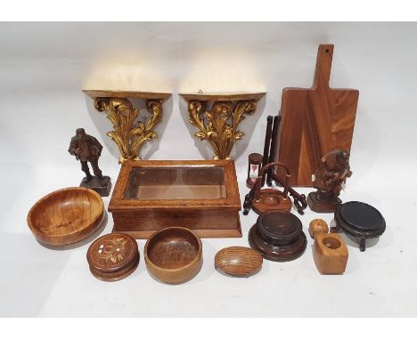 Box of wooden items to include chopping board, wall mounts, bowl, figure of man and woman, box with glass lid on hinges, sand