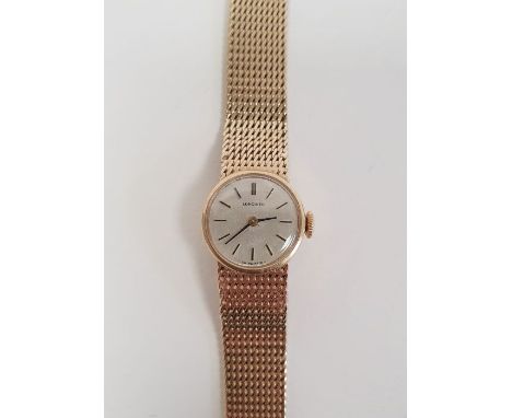Lady's 9ct gold Longines wristwatch with circular dial, baton numerals, side button and 9ct gold flexible mesh strap, gross w
