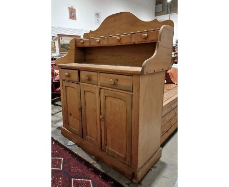 Vintage pine dresser, the galleried back with four drawers, on a base of three short drawers and two cupboard doors, raised o