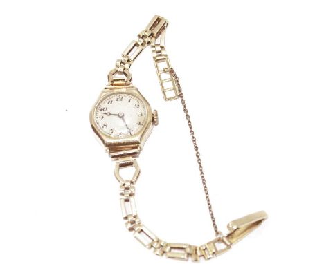 Lady's 9ct gold vintage wristwatch with circular dial, Roman numerals, in octagonal case and the 9ct gold rectangular chain l