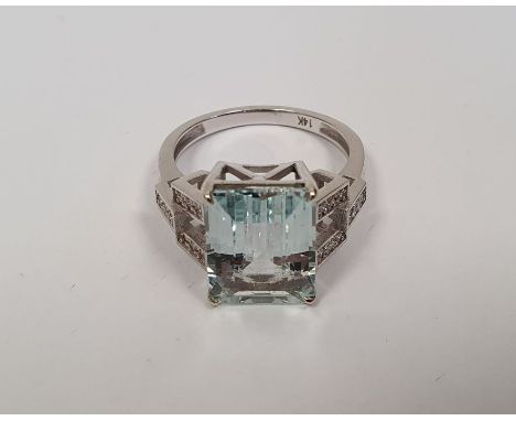 14K gold, aquamarine and diamond ring set central rectangular cut pastel blue aquamarine, approx. 4ct and having angular open