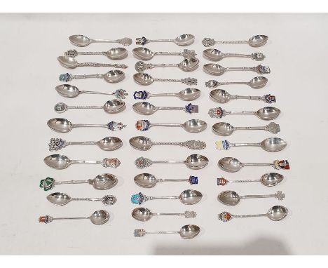 Thirty seven assorted silver souvenir teaspoons including examples with enamel finials bearing the arms of Dublin, Worcester,