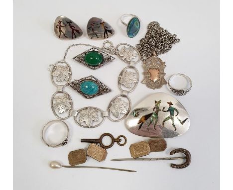 Silver pendant with gold applied vacant cartouche, a silver horseshoe stickpin, a pair of silver engine turned and enamel cuf