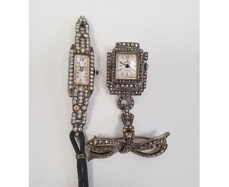 Lady's Bucherer white metal and marcasite pendant dress watch in rectangular case suspended from ribbon brooch and another la